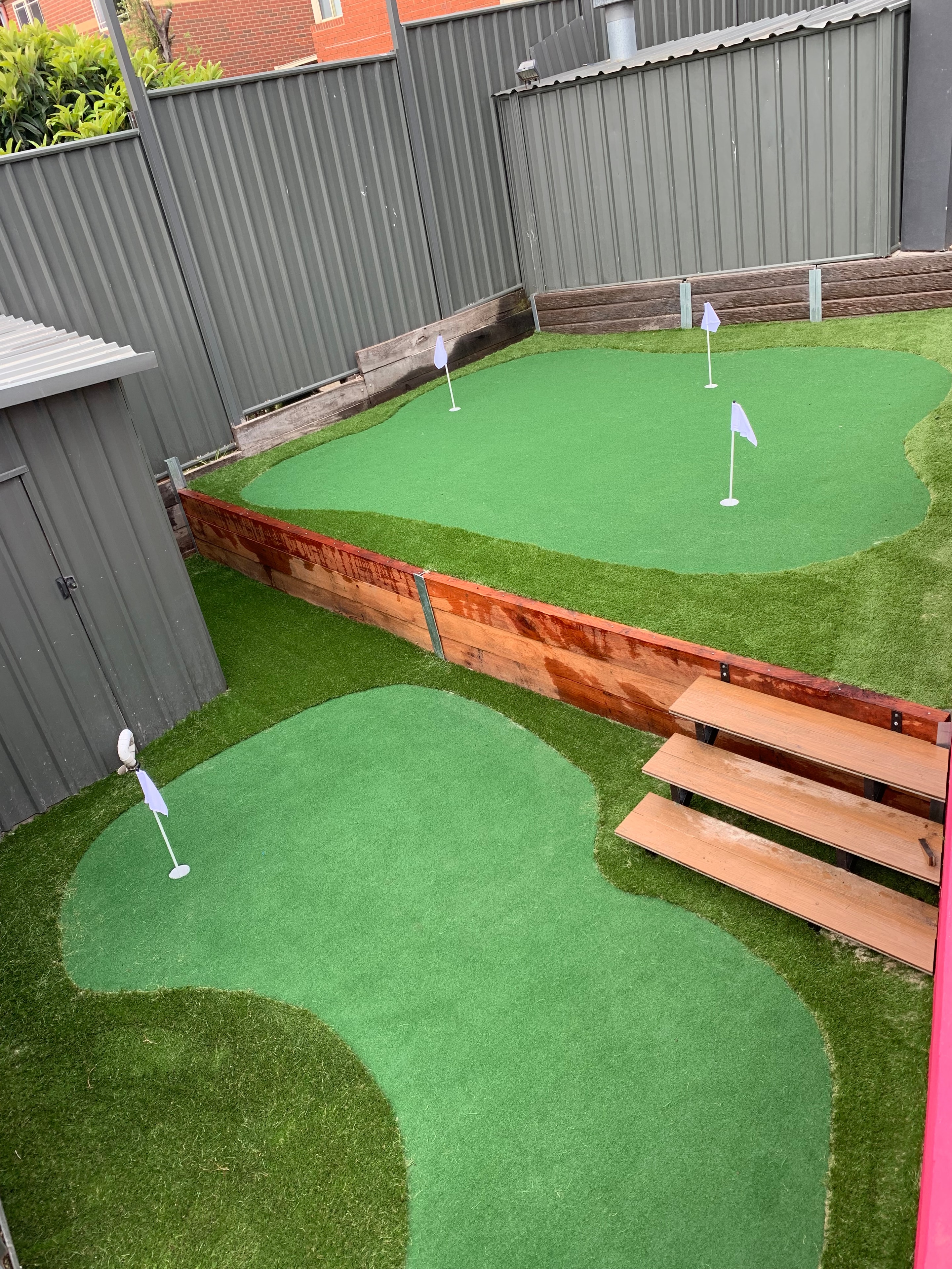 Mini golf course with obstacles and synthetic turf
